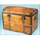 Antique trunk with metal reinforcements.