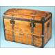 Antique trunk with metal reinforcements.