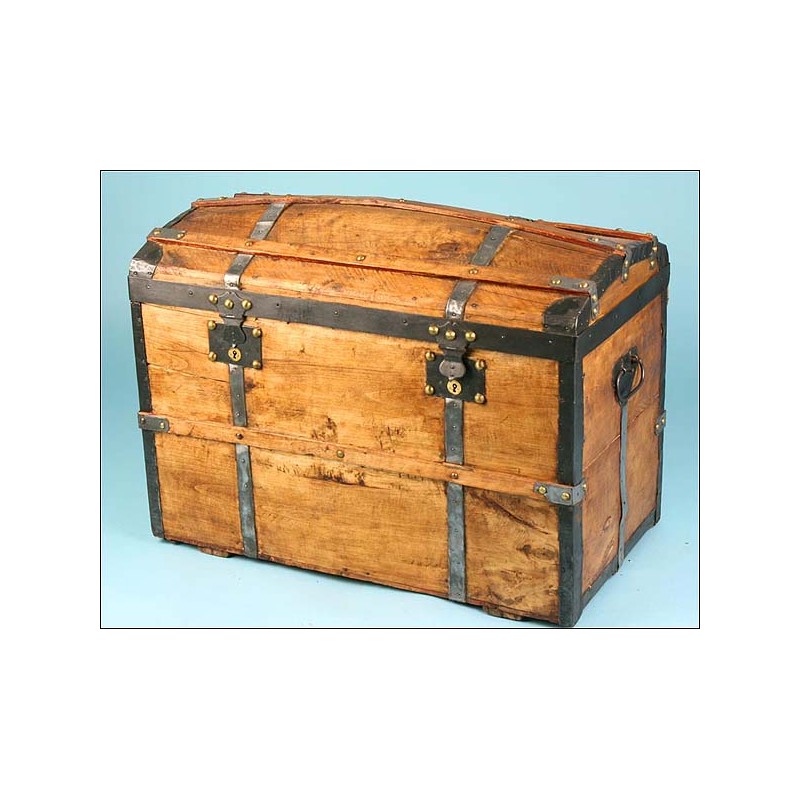 Antique trunk with metal reinforcements.