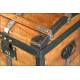 Antique trunk with metal reinforcements.