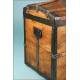 Antique trunk with metal reinforcements.