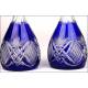 Pair of Bohemian crystal decanters with solid silver mouths.