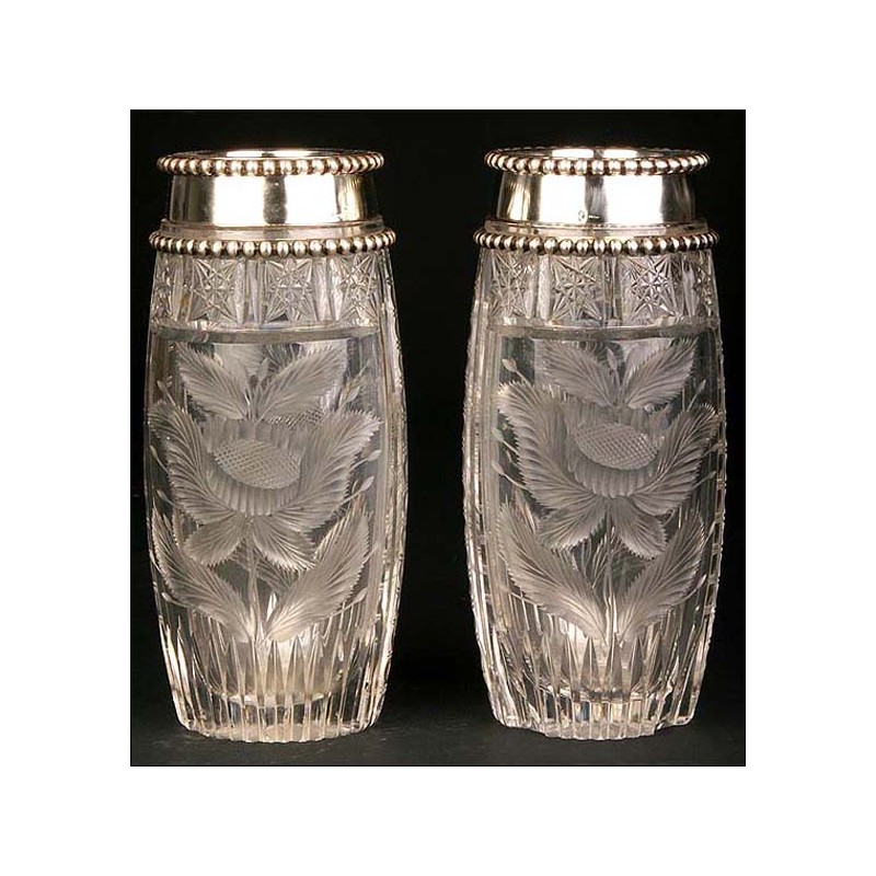 Pair of crystal vases with solid silver rim.