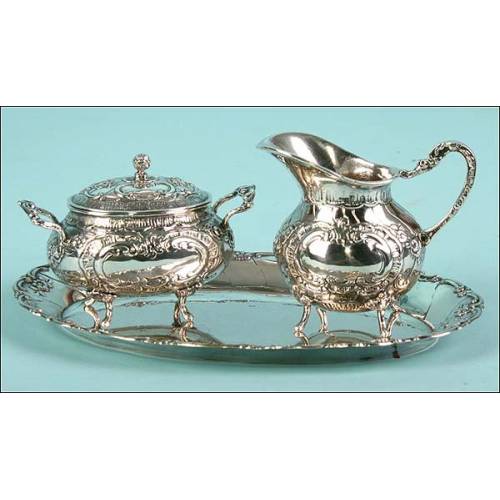 Set de servicio en tres piezas de plata 800 C.1900