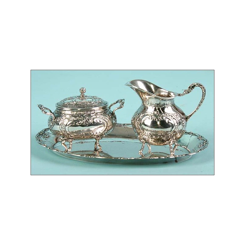 Set de servicio en tres piezas de plata 800 C.1900