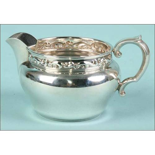 Solid 925 sterling silver serving pitcher.