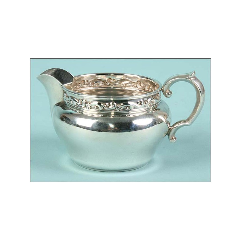 Solid 925 sterling silver serving pitcher.