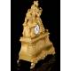 Antique Mantel Clock in Gilded Bronze. France, 1850