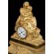 Antique Mantel Clock in Gilded Bronze. Virgin of the Chair. France, 1870