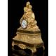 Antique Mantel Clock in Gilded Bronze. Virgin of the Chair. France, 1870