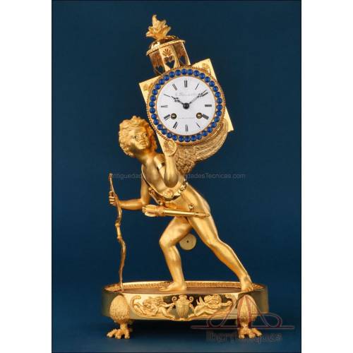 'La Linterna Mágica'. Antiguo reloj imperio de bronce dorado. Francia, siglo XIX