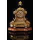 Antique French Mantel Clock in Gilt Bronze. S.XIX.