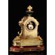 Antique French Mantel Clock in Gilt Bronze. S.XIX.