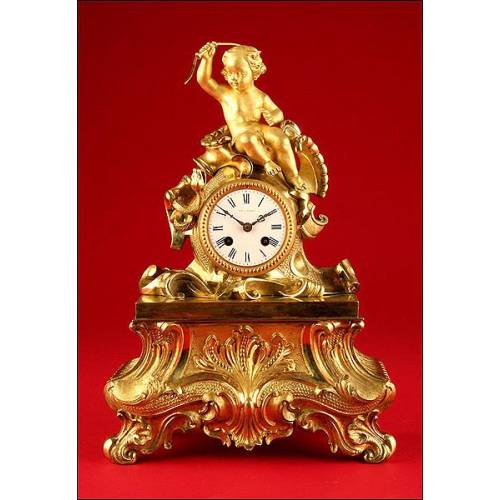 Decorative Mantel Clock in Gilded Bronze. Second half s. XIX.