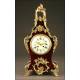 Magnificent mantel clock in wood and tortoise shell. XIX Century.