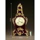 Magnificent mantel clock in wood and tortoise shell. XIX Century.