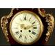Magnificent mantel clock in wood and tortoise shell. XIX Century.