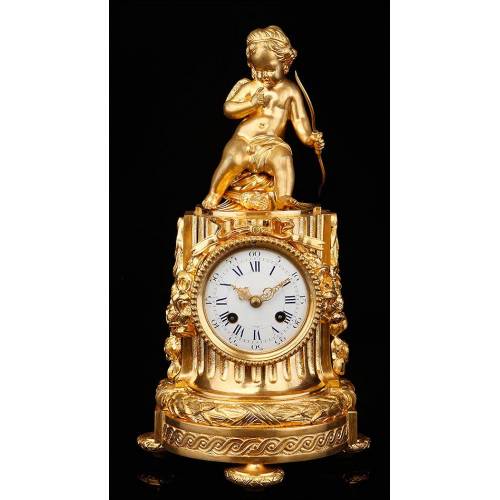 Delicate Mantel Clock in Gilded Bronze with Cupid. France, XIX Century