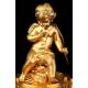 Delicate Mantel Clock in Gilded Bronze with Cupid. France, XIX Century