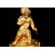 Delicate Mantel Clock in Gilded Bronze with Cupid. France, XIX Century