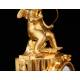 Delicate Mantel Clock in Gilded Bronze with Cupid. France, XIX Century