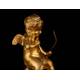 Delicate Mantel Clock in Gilded Bronze with Cupid. France, XIX Century