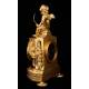 Delicate Mantel Clock in Gilded Bronze with Cupid. France, XIX Century
