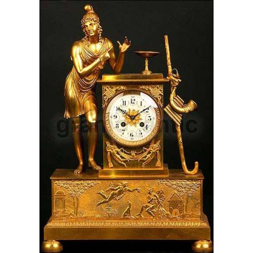Antique French gilt bronze clock. 1850. Allegory of music