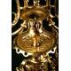 Reloj de péndulo en bronce con guarnición. Final s. XIX