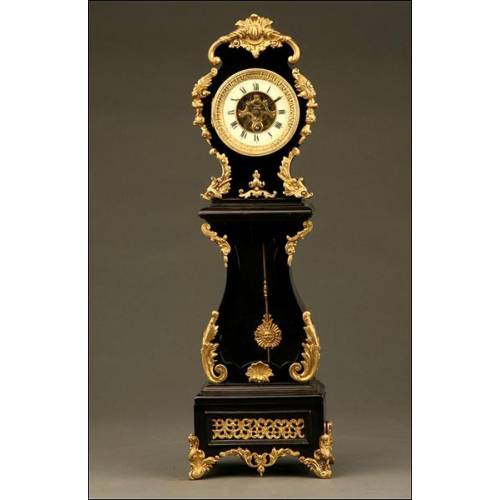 Curious Rococo Mantel Clock in Ebonized Wood and Brass Sconces, ca.1900.