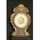 Curious Rococo Mantel Clock in Ebonized Wood and Brass Sconces, ca.1900.