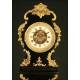 Curious Rococo Mantel Clock in Ebonized Wood and Brass Sconces, ca.1900.