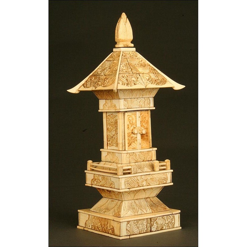 Chinese Carved Ivory Pagoda. XIX Century. Contains a Buddha behind the Upper Doors.